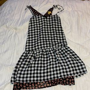 It’s and xs dress that is plaid with flowers.